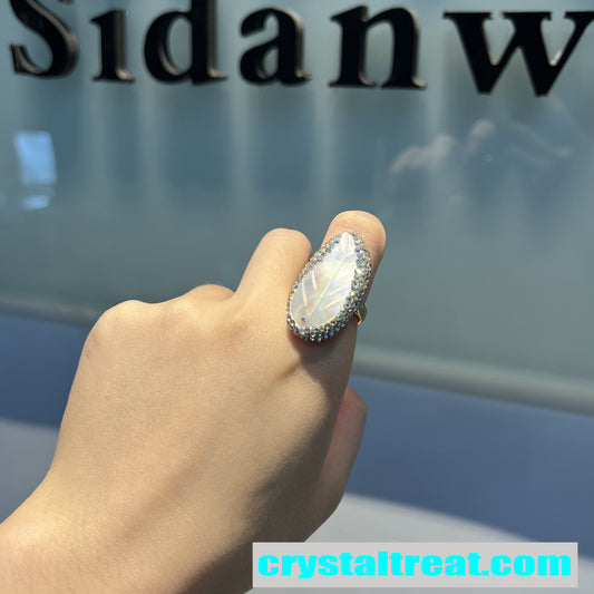 Carved Mother of Pearl Feather Ring with Crystal Halo