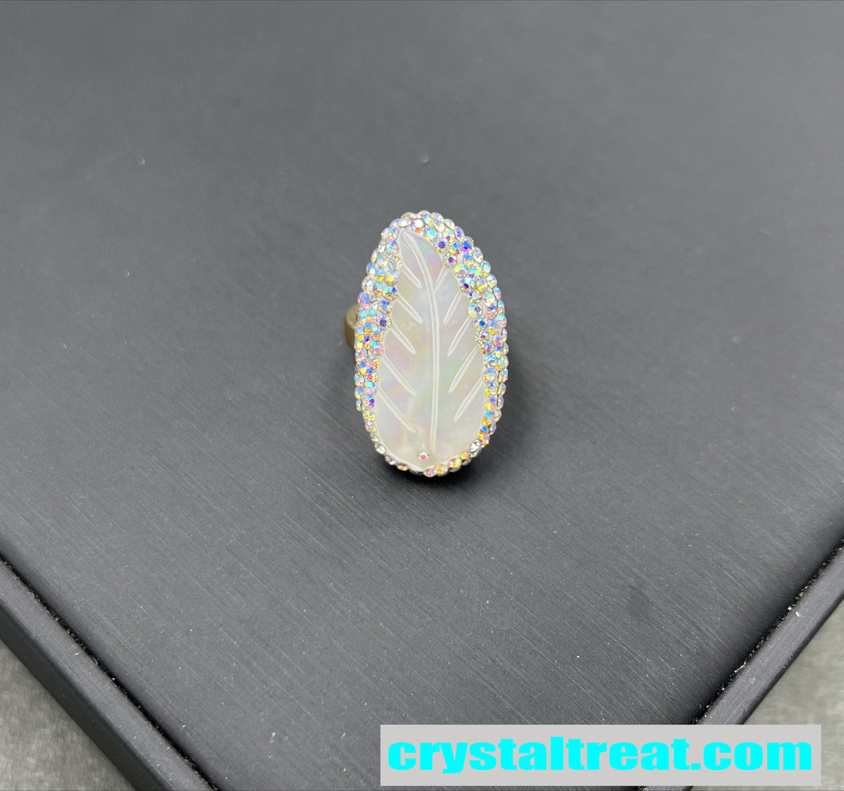 Carved Mother of Pearl Feather Ring with Crystal Halo